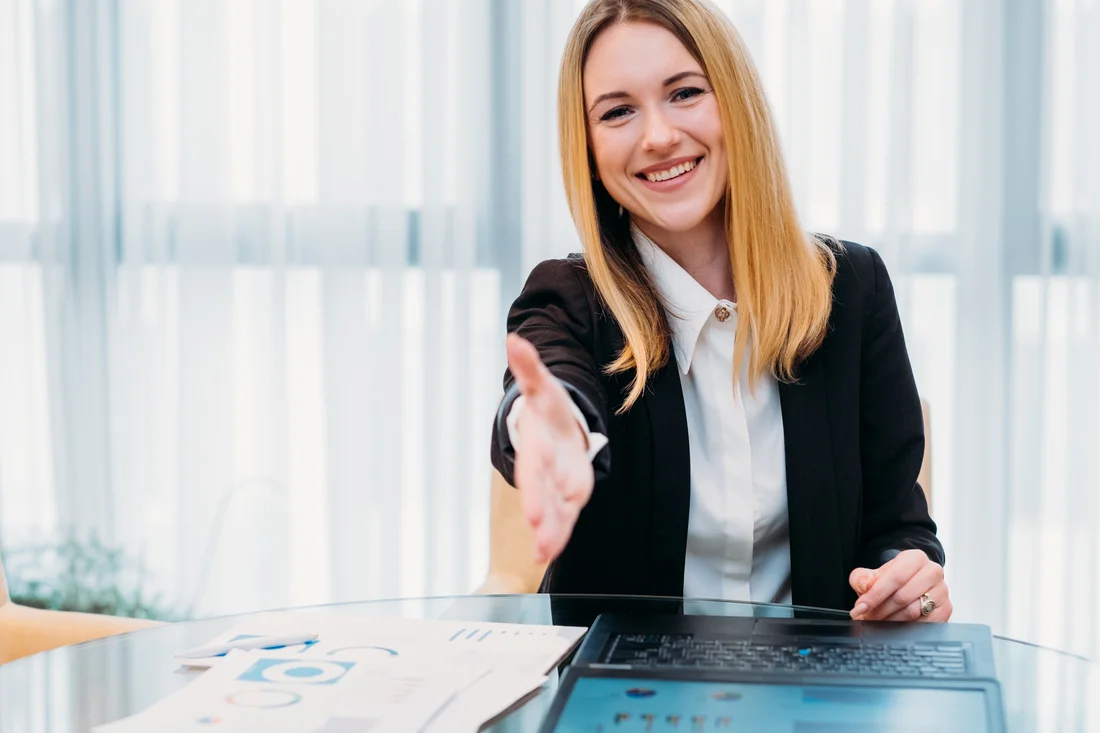 A welcoming handshake at a recruiting conversation